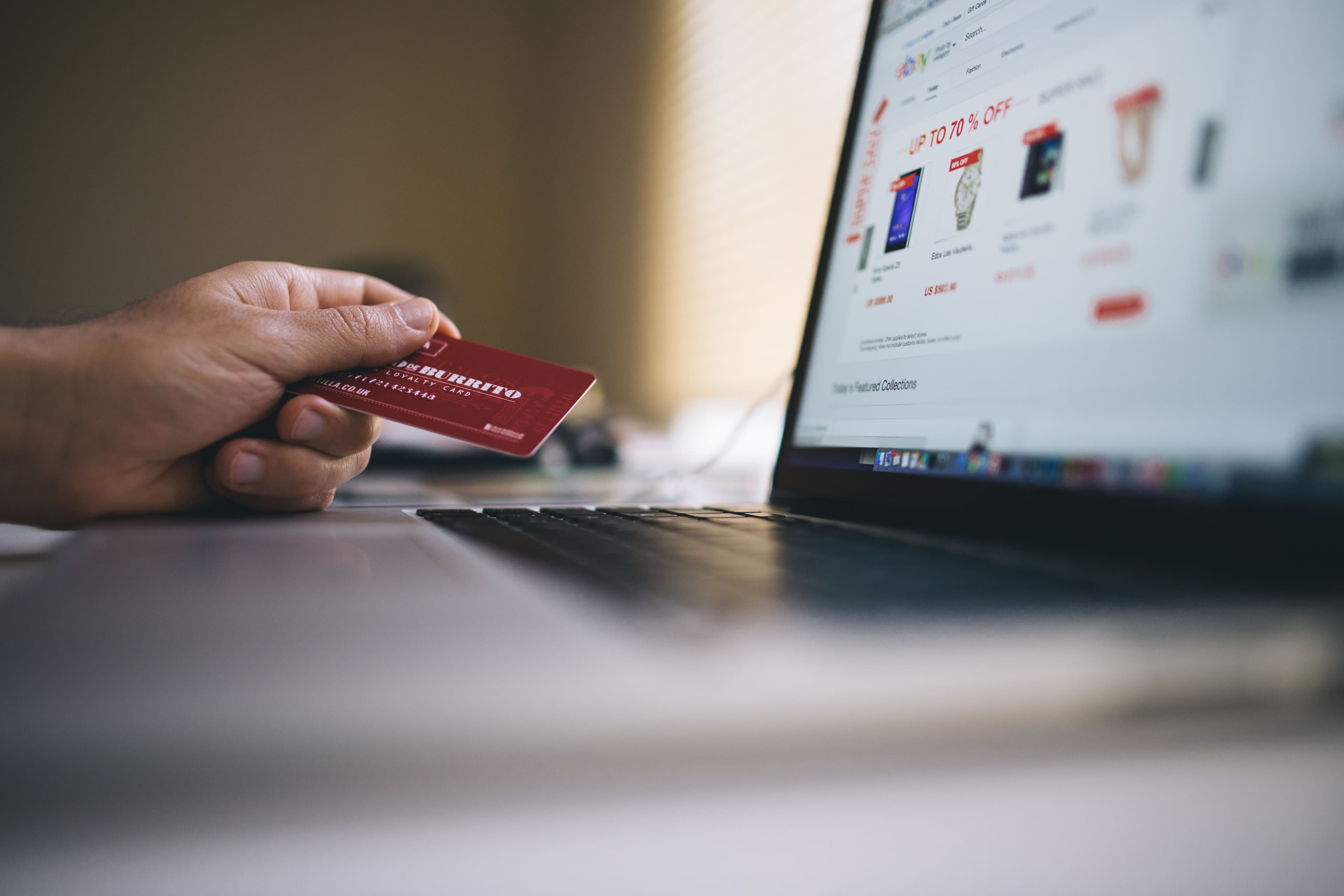 Packages, a barcode scanner, and an order-management screen representing e-commerce operations