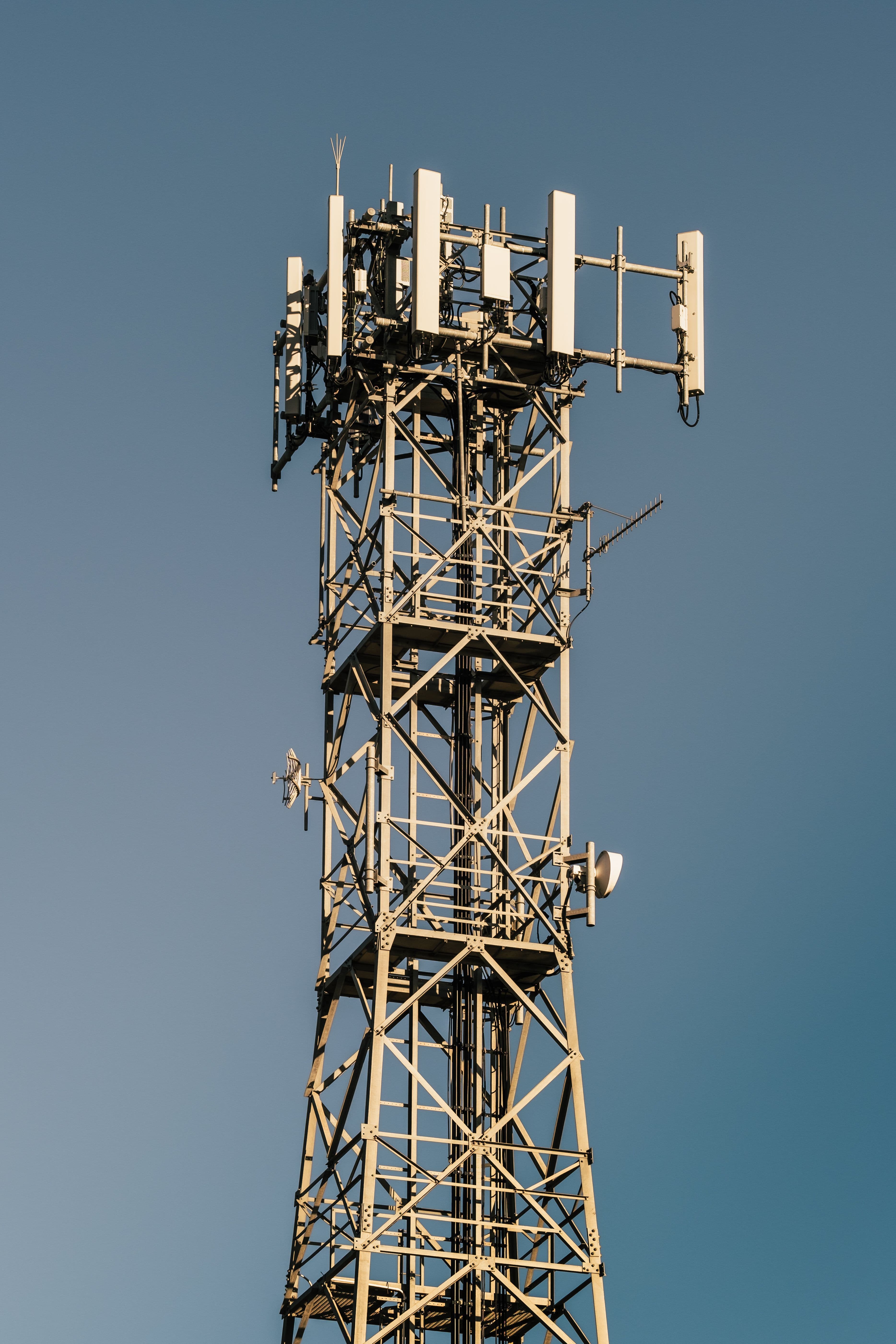 Network racks and fiber connections representing telecommunications systems